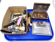 A tray containing a quantity of assorted wristwatches, walking stick badges,
