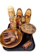 A tray containing wooden pieces including carved wooden figures, miniature occasional table etc.