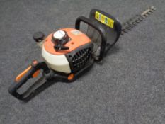 A petrol hedge cutter.