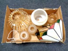 A box of 20th century glass light shades together with a Tiffany style leaded glass light shade