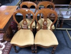A set of four Victorian mahogany dining chairs.