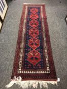 A fringed Iranian runner 74 cm x 240 cm