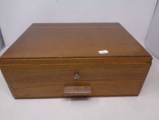 An oak cutlery canteen with key