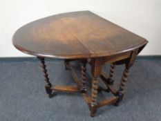 A 20th century oak barley twist gate leg table.