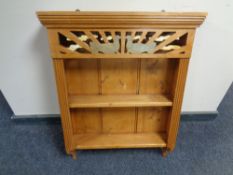 A pine wall mounted rack.