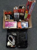 A box containing a quantity of assorted power tools, battery chargers, sanding disks.