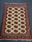 A Bokhara rug on cream ground 162cm by 113cm