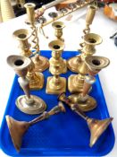 A tray of five pairs of brass candlesticks