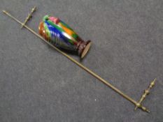 A 19th century brass and copper range rail together with a majolica style glazed pottery vase