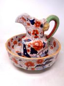 An ironstone jug and basin