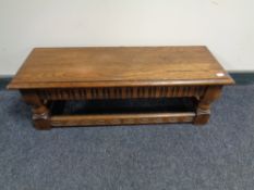 An oak duet footstool.