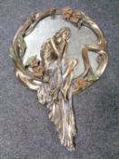 An Art Nouveau style mirror.