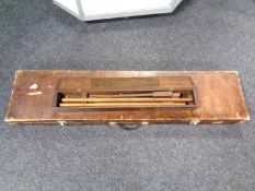 A gun case and further box containing gun cleaning equipment.