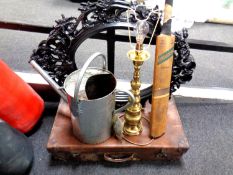 A galvanized watering can, continental brass table lamp, cricket bat,