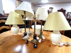 Six contemporary metal and ceramic table lamps with shades.