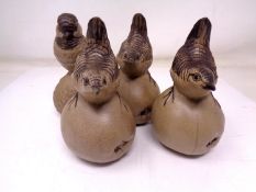 A group of four Poole china bird ornaments (tallest 12cm).