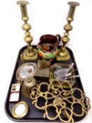 A tray containing a pair of 19th century candlesticks, a trivet, glass ashtray,