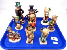 A tray of nine Goebel figures of girls and boys.