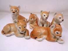 A group of six USSR china lion cub figures.