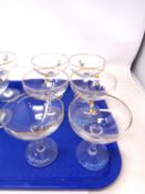 A set of six Babycham glasses.