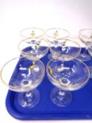 A set of six Babycham glasses.