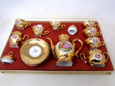 A boxed Bondware gilt coffee set.