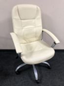 An executive swivel office armchair, cream.