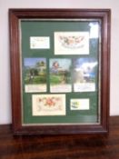 A framed montage of World War I postcards.