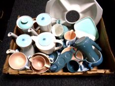 A box of miscellaneous Poole pottery dinner wares.