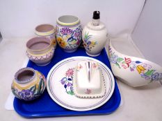 A tray of eight pieces of Poole pottery including a lamp base, butter dish, vases etc.