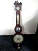 A George III barometer with silvered dial.