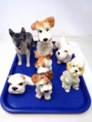 A tray of English pottery dog ornaments.