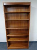 A set of 20th century teak open bookshelves (width 90cm).