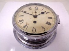 A 20th century chrome cased circular wall timepiece (diameter 20cm).