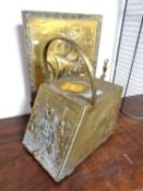 A brass coal receiver together with a fire screen.