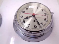 A 20th century chrome cased circular wall timepiece (diameter 22cm).