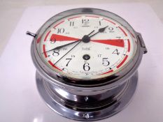 A 20th century Sestrel chrome cased circular wall timepiece (diameter 20cm).
