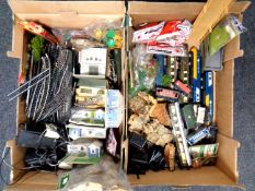 Two boxes containing a quantity of assorted rolling stock, track, accessories, buildings,