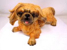 A Goebel figure of a Pekingese dog (length 31cm).
