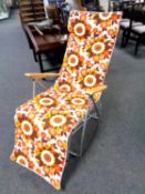 A late 20th century tubular metal folding garden lounger.
