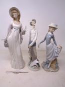 Three Lladro figures, Don Quixote together with two further figures of ladies.