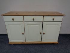 A triple door painted pine sideboard.