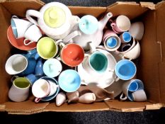 A box of miscellaneous Poole pottery dinner wares.