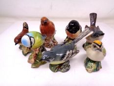 A group of seven Beswick birds including whitethroat, stonechat, robin, goldcrest etc.