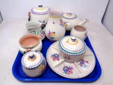 A tray of nine pieces of Poole pottery.