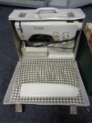 A Viking Husqvarna electric sewing machine in box together with a further box containing buttons