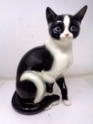 A Goebel china figure of a cat (height 26cm).