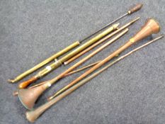 A box containing a quantity of vintage copper hunting horns together with two further vintage brass
