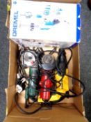 A box containing boxed dremel, DeWalt power drill, two angle grinders.