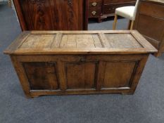 A George III panelled oak coffer (length 112cm).